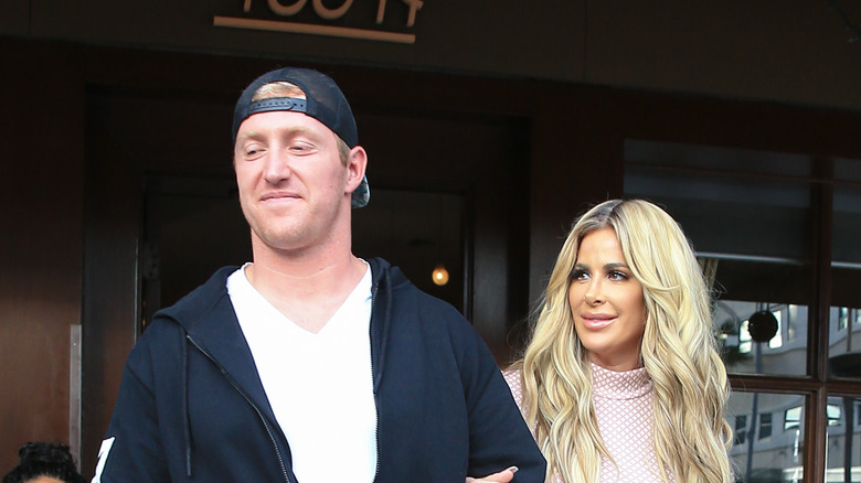 Kroy Biermann and Kim Zolciak walking