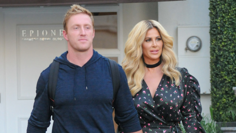 Kroy Biermann and Kim Zolciak walking