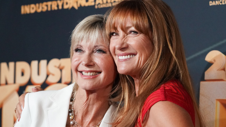 Olivia Newton-John and Jane Seymour hugging