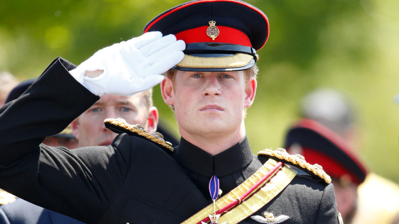 Prince Harry saluting in uniform