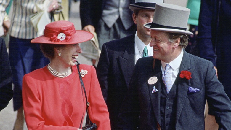 Princess Anne and Andrew Parker Bowles smiling at each other