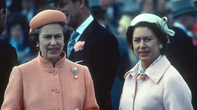 Queen Elizabeth and Princess Margaret in coats and hats