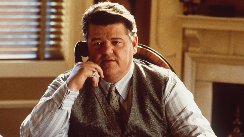 Robbie Coltrane talking on the phone 