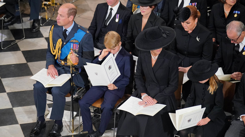 Prince George wipes away tears at queen's funeral