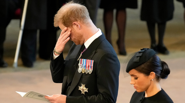 Prince Harry hides eyes at Elizabeth's funeral