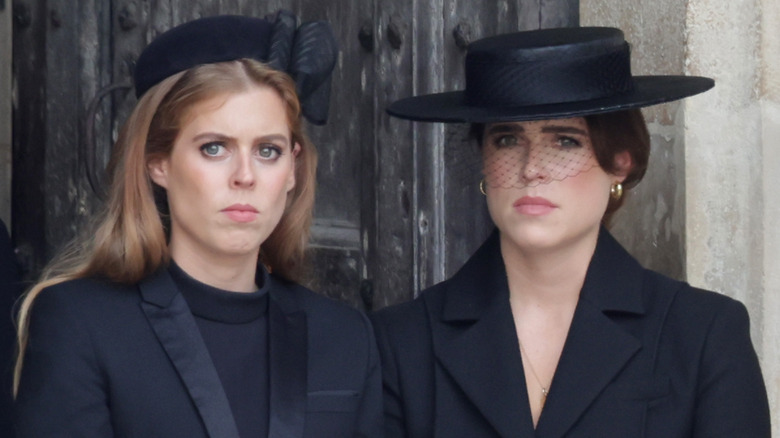 Princess Eugenie and Princess Beatrice looking distraught