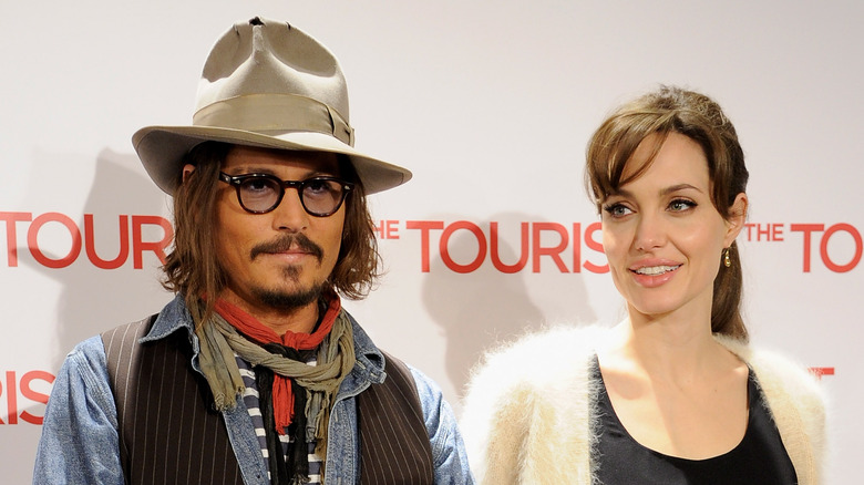 Angelina Jolie and Johnny Depp posing