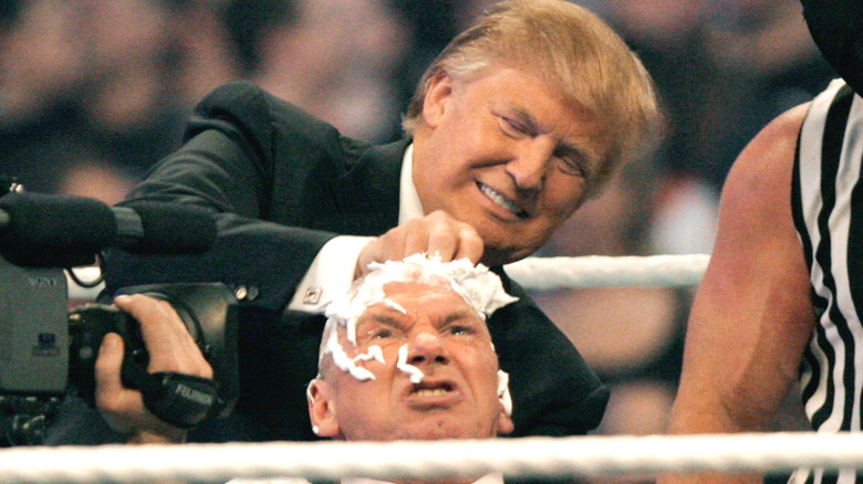 Donald Trump shaving Vince McMahon's head.