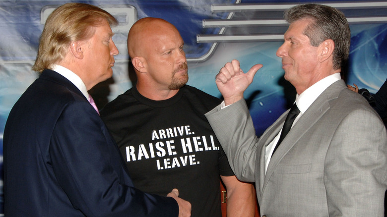 Vince McMahon standing face to face with Donald Trump.