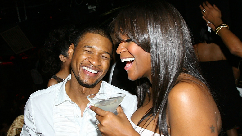 Usher and Tameka Foster laughing