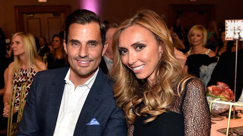 Giuliana and Bill Rancic posing for photos