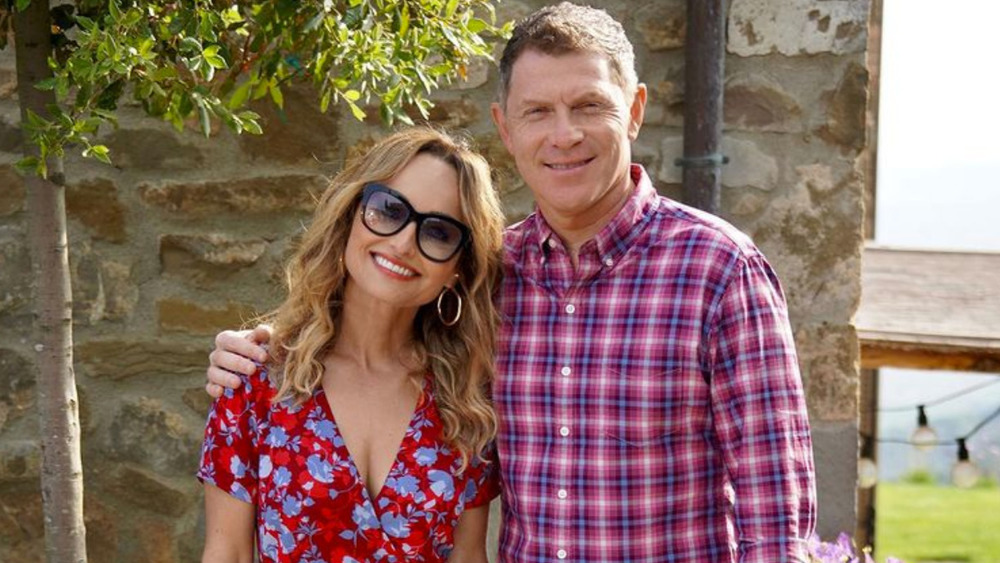 Bobby Flay with his arm around Giada De Laurentiis