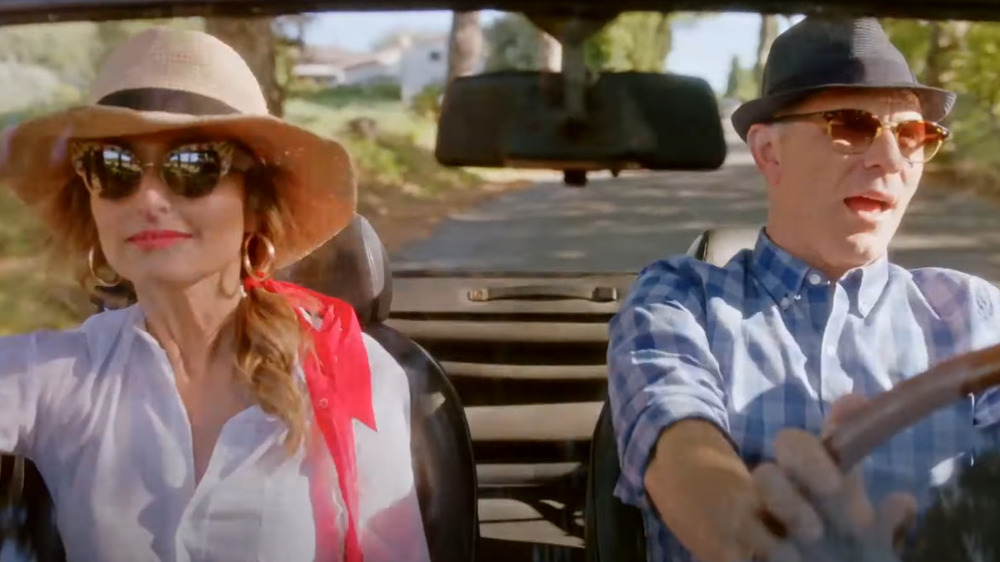 Bobby Flay and Giada De Laurentiis driving in a car