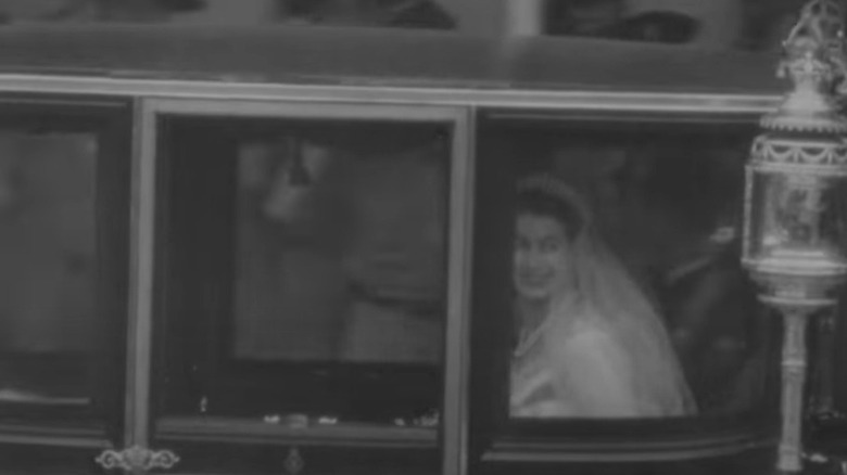 Prince Philip and Queen Elizabeth in a carriage after their wedding