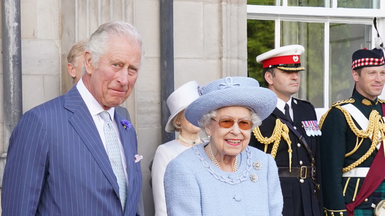 Queen Elizabeth and Prince Charles smiling 