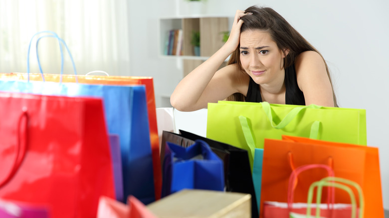 A woman experiencing buyer's remorse