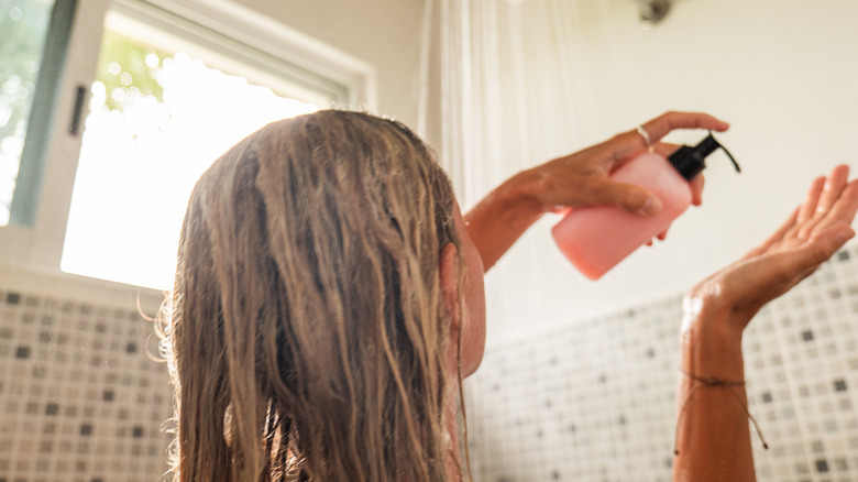 woman washing hair in shower