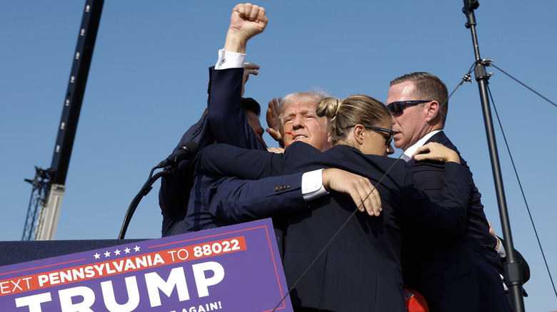 Secret Service agents surrounding Trump