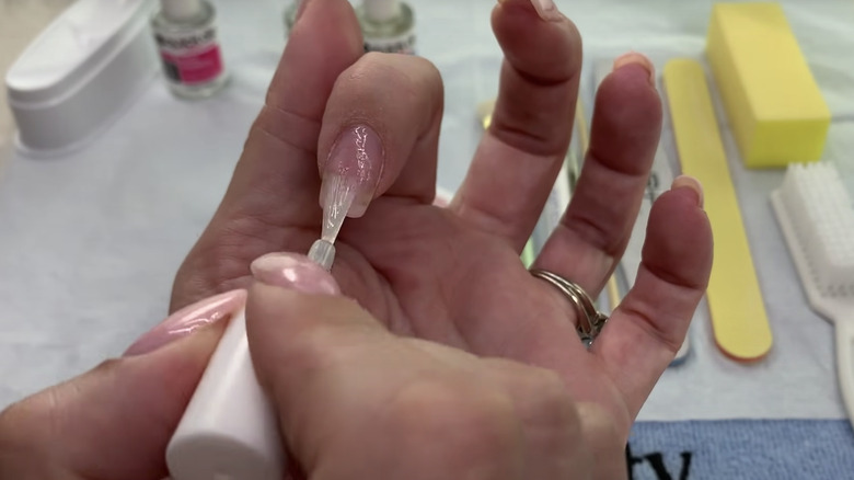 Woman applying nail polish