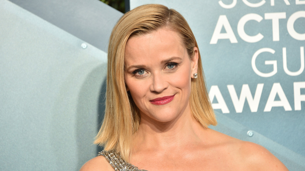 Reese Witherspoon on carpet in gown