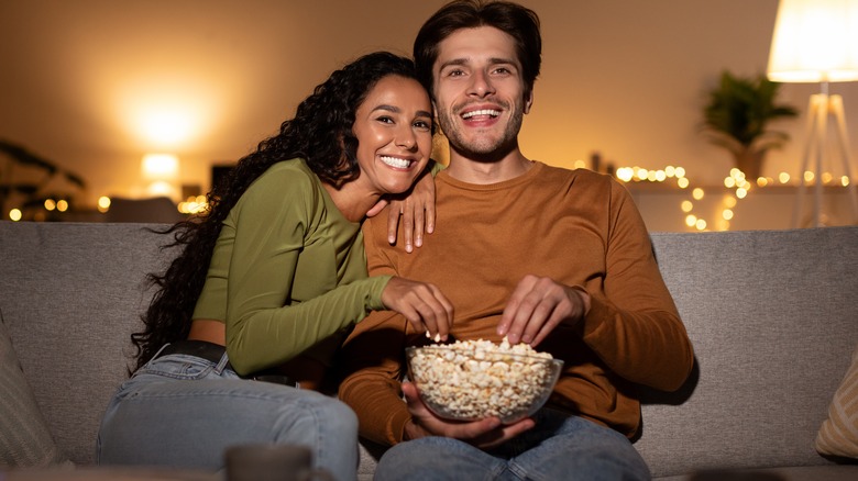 On the couch with popcorn