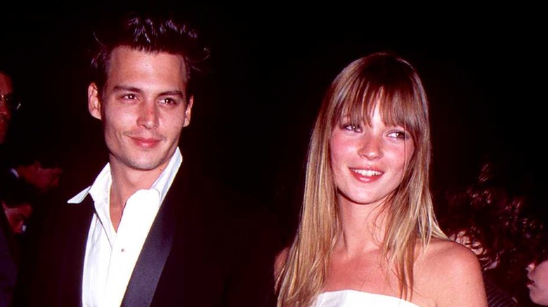 Johnny Depp and Kate Moss smiling 