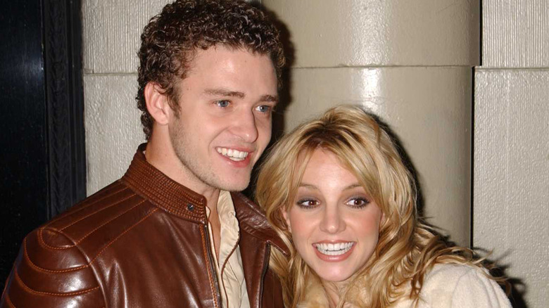 Britney Spears smiling widely with Justin Timberlake