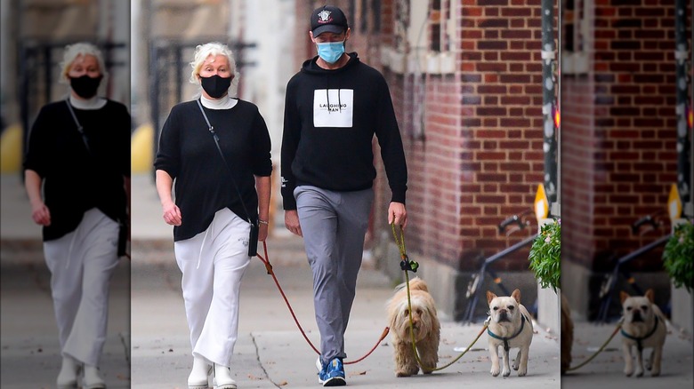 Hugh Jackman and Deborra-Lee Furness walking dogs