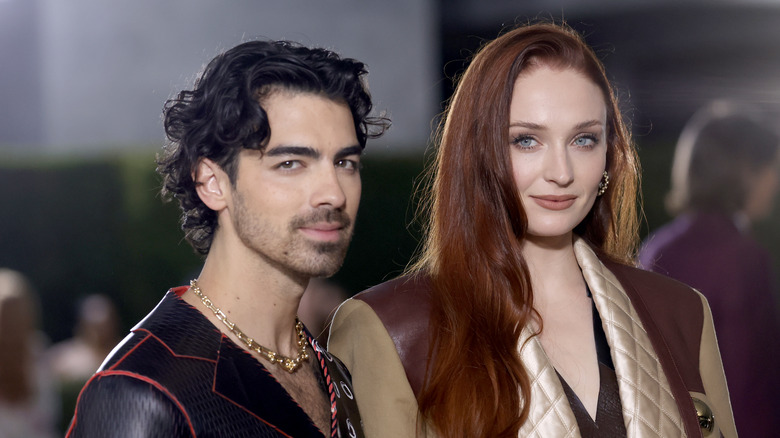 Sophie Turner and Joe Jonas looking at the camera