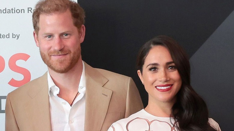 Harry and Meghan smiling 