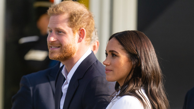 Harry and Meghan smiling 