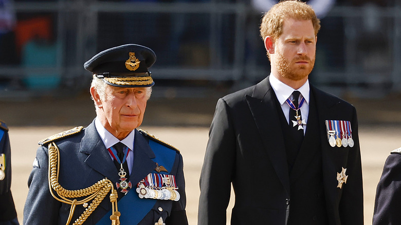 King Charles and Prince Harry walking