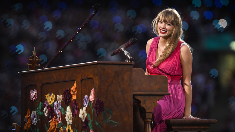 Taylor Swift sitting at piano 