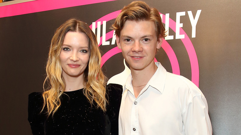 Thomas Brodie-Sangster and Talulah Riley posing 