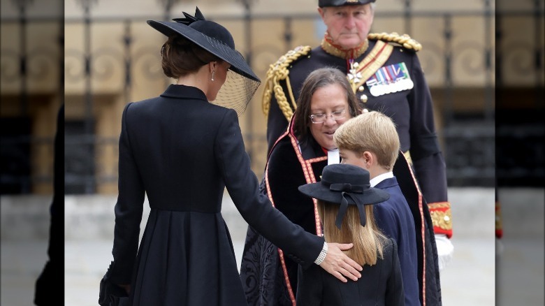 Kate Middleton comforting Princess Charlotte