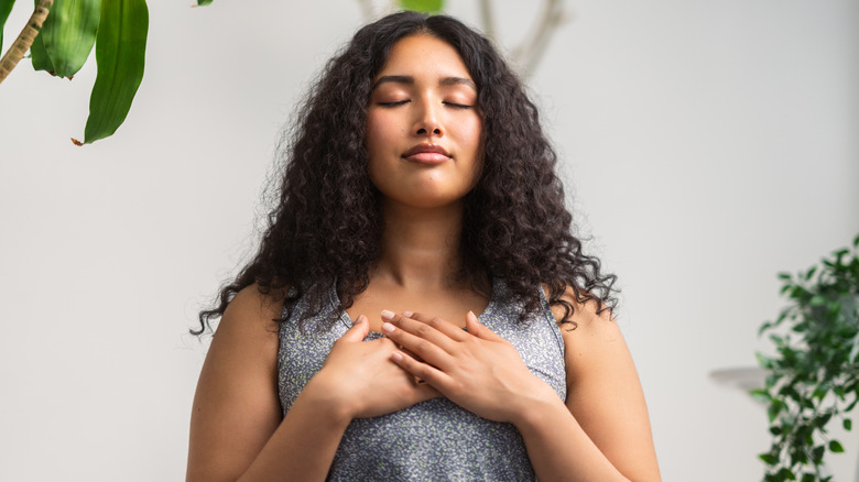 Woman practicing deep breathing 