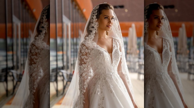 Bride wearing lace veil 