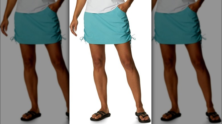 Model wearing teal colored skort