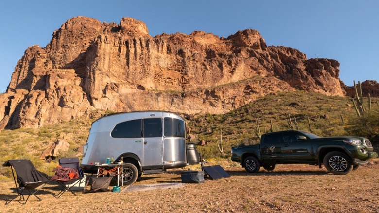 Silver Airstream trailer in the mountains