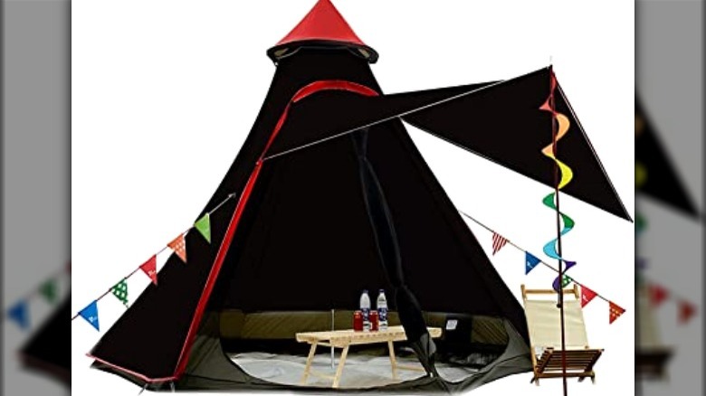 White glamping tent with colorful decorations