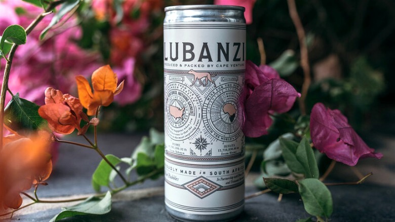 Can of wine with pink and orange flowers