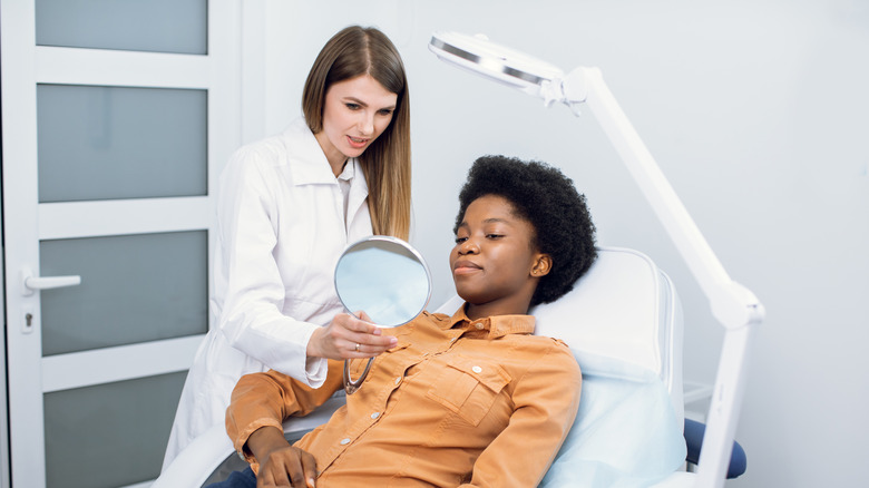 Woman at dermatologist office