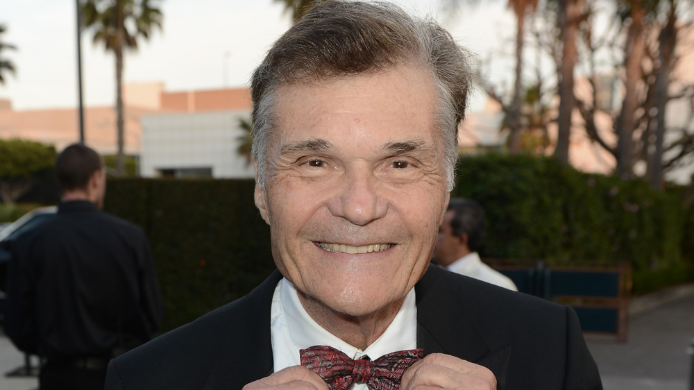 Fred Willard wearing a bow tie, smiling