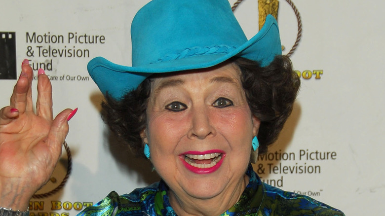 Jane Withers in a blue hat 