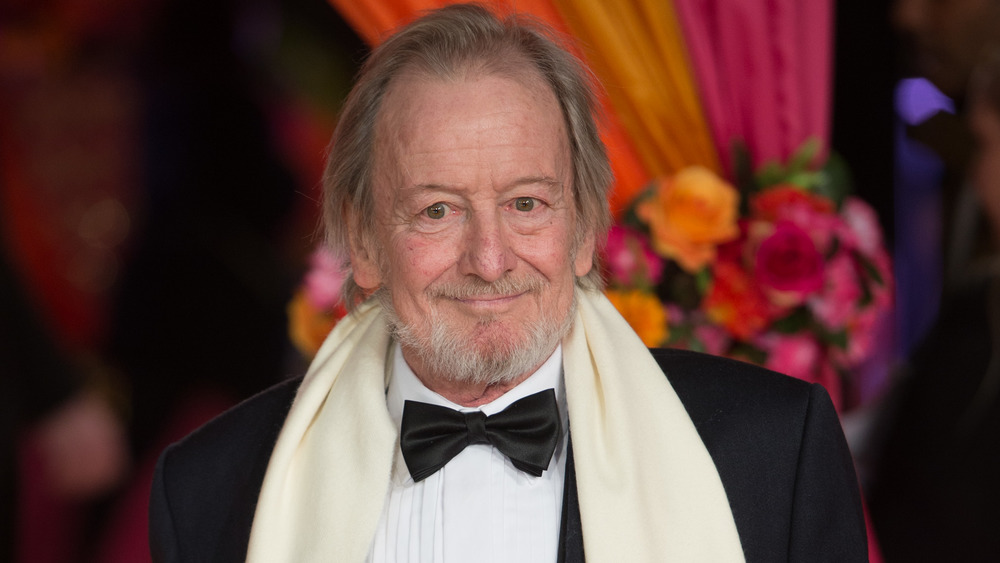 Ronald Pickup in a tuxedo 