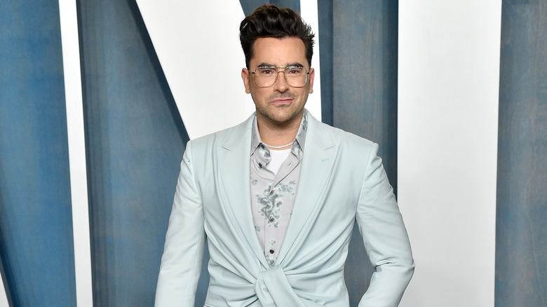 Dan Levy smiling