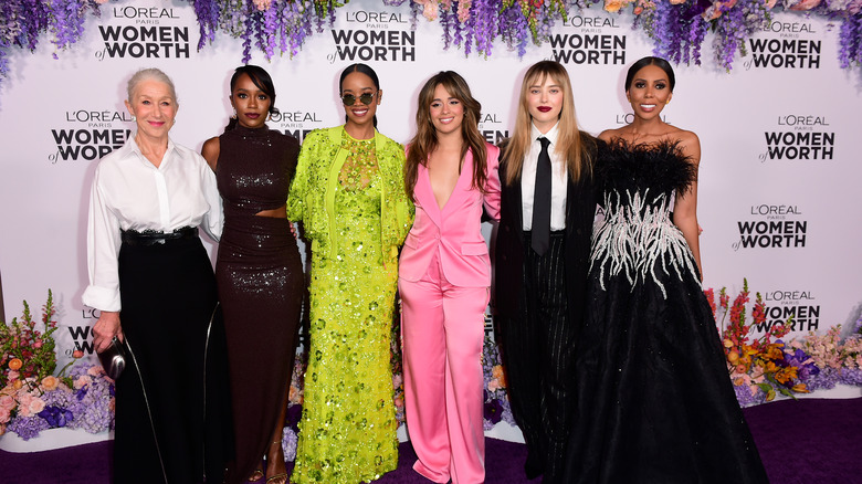 Helen Mirren, Aja Naomi King, H.E.R., Camila Cabello, Katherine Langford, and Jaha Dukureh smiling at L'Oréal Paris Women of Worth Celebration