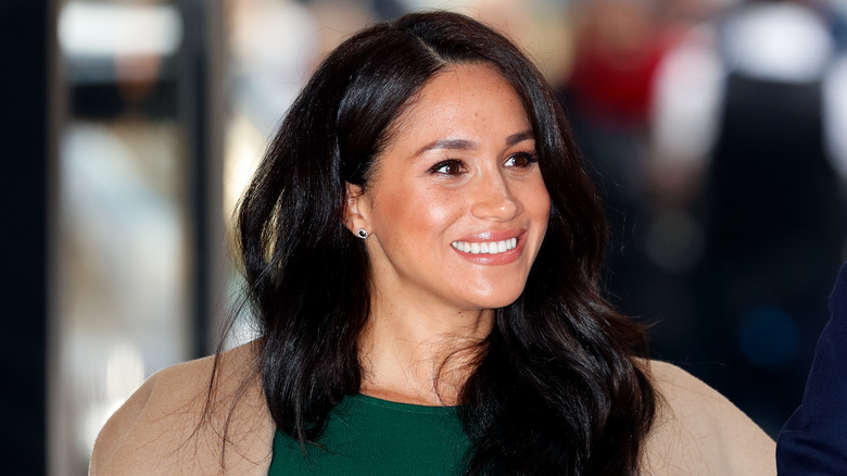 Meghan Markle smiles at an event.