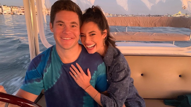 Chloe and Adam on their boat after the proposal