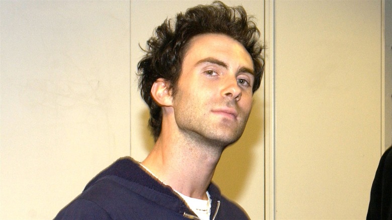 A young Adam Levine posing